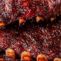 1/2Lb Pork Spare Ribs [Aprox. 2-3 Ribs] · Smoked over hard wood and done to tenderness
