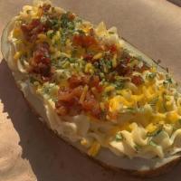 Twice Baked Loaded Potato · A Jumbo half spud stuffed with fluffy mashed potato and fully loaded with butter, sour cream...