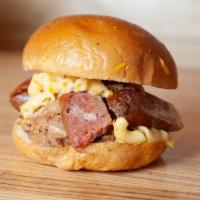 The Pork Fork Sandwich · Pulled Pork & choice of sliced Pork & Beef or Jalapeño & Beef Smoked Akaushi Sausage, topped...