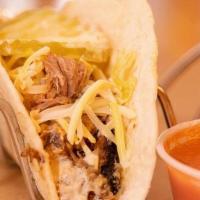 Cuban Taco* · Swiss cheese, slow-smoked pulled pork, grain mustard, house brined pickle, flour tortilla