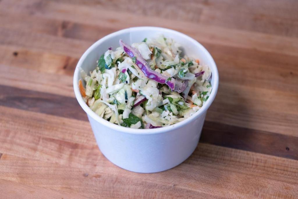 Sm Cole Slaw (V) · Fresh cabbage and carrots with a sweet & Savory dressing prepared Texas Style