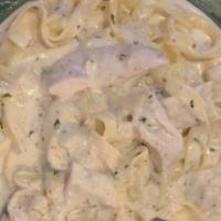 Fettuccini Alfredo With Chicken · Our famous Alfredo sauce with fettuccini pasta and grilled chicken.