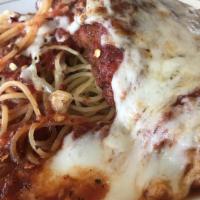 Chicken Parmigiana · Chicken topped with marinara sauce and mozzarella cheese over spaghetti.