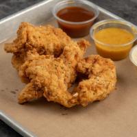 Duck Fat Fried Chicken Strips · Served with trio of house made sauces.