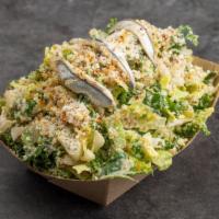 Shak Caesar Salad · Seasonal kale salad, duck fat fried bread crumbs, white marinated anchovies.