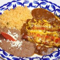 Cheese Enchiladas · [2] Cheese Enchiladas topped Chili Meat Gravy and Cheddar Cheese. Served with Spanish Rice a...