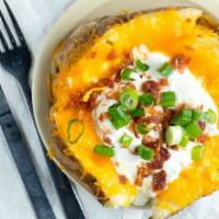 Large Baked Potato · With butter, cheese, sour cream, bacon and chives.