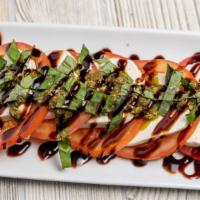Tomato Caprese · New. Sliced beef steak tomatoes with fresh mozzarella cheese, basil, and a balsamic glaze.