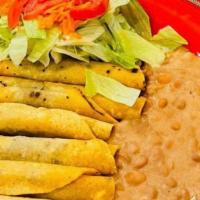 6-Flautas With Rice And Beans  · 6-Shredded Beef Flautas with Rice, Beans, Lettuce Tomato and Grated Carrots.
6-Flautas de Ca...