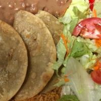 3 Ground Beef Tacos/3 Tacos De Picadillo  · 3-Ground beef tacos served with rice and beans and with lettuce, diced tomatoes and grated c...
