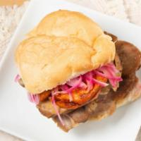 Pan Con Chicharron Sandwich · Most popular. Fried pork slices, fried sweet potato slices, and pickled onions. Served in au...