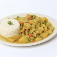 Cau Cau · Beef tripe with potatoes on a Peruvian yellow pepper sauce served with rice.