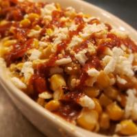 Roasted Mexican Corn · Grilled corn tossed with mayonnaise, sour cream & chile powder topped with cilantro, queso f...