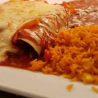 Enchiladas Mexicana · Two sautéed beef fajita enchiladas topped with ranchero sauce. Served with rice and refried ...