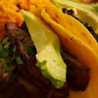 Calle Tacos · Three soft corn tortillas topped with fajita beef or fajita chicken, served with  cilantro a...
