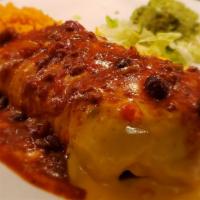 Burrito Dinner · Large flour tortilla filled with seasoned ground beef or shredded chicken, rice and refried ...
