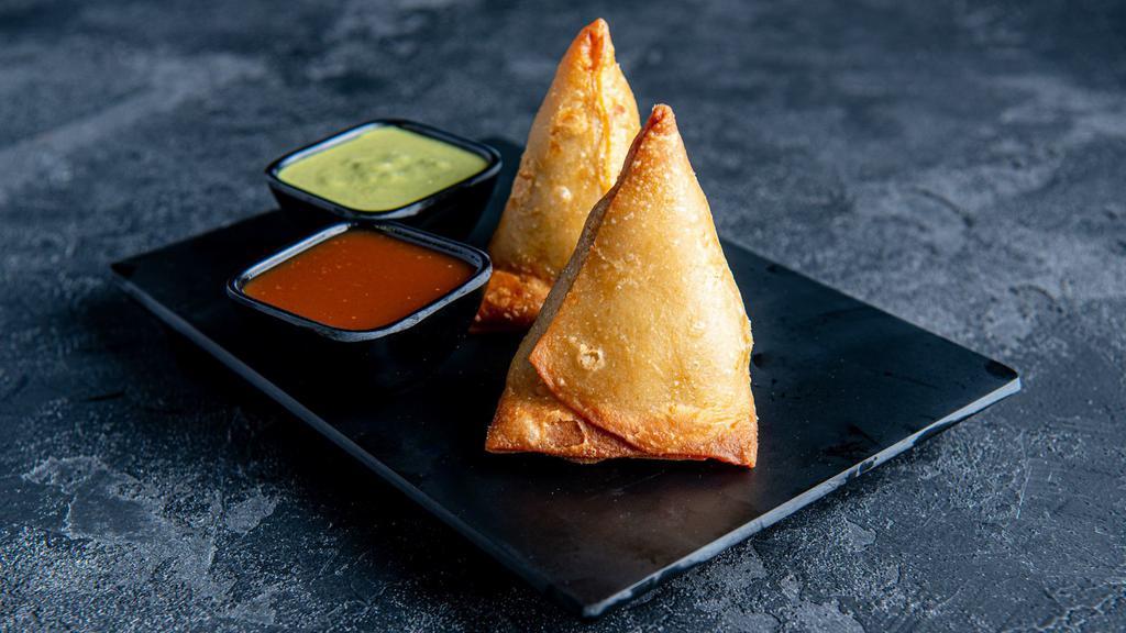 Samosa · Triangular fried pastry with a savoury filling of spiced vegetables.