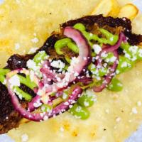 Smoked Brisket · Cotija, pickled red onion, avocado crema, French fries.