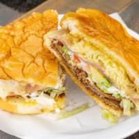 Torta Cubana  · Torta Bread with lettuce, tomato, avocado, sour cream, ham, cheese, and your choice of meat