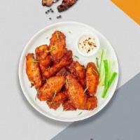 Cheeky Wings · Fresh chicken wings breaded and fried until golden brown, tossed in mild sauce.