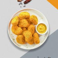 International Court Of Chicken Nuggets · Bite sized nuggets of chicken breaded and fried until golden brown.