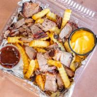 Smoked Prime Brisket Topped Fries · Our signature crinkle cut fries, topped with 16 hrs slow smoked prime brisket, nachos cheese...