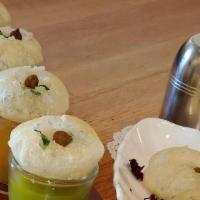 Pani Puri   ( J )  ( S ) · Eight pieces round, hollow puri, fried crisp and filled with a mixture of three types of fla...