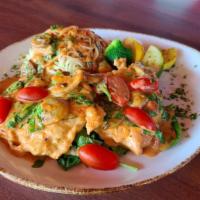 Florentine Madeira · Chicken breast sautéed with mushrooms, shallots, fresh spinach and cherry tomatoes with swee...