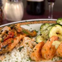 Grilled Salmon And Shrimp · Grilled Salmon and shrimp with a side of arborio rice and grilled veggies. Sauce of your cho...