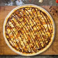 Clucker Sizzlers Pizza · BBQ sauce, mozzarella cheese, red onion, BBQ chicken and cheese baked in a stone oven