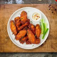 Classic Panic Wings · Fresh chicken wings breaded and fried until golden brown. Served with a side of ranch or ble...
