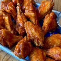 16 Wings · 16 Bone-In Wings, tossed in your choice of sauce. Served with one Ranch or Bleu Cheese Dress...