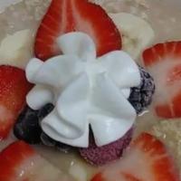 Fruit & Honey Oatmeal · Served with strawberries, bananas and a side of whole wheat toast.