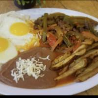 Steak Ranchero · Served with two eggs, red potatoes and beans.