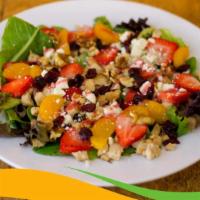 Walnut Strawberry Salad · Served with spinach and spring leaf, grilled chicken breast, strawberries, dried cranberries...