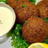 Falafel Side · Freshly fried patties made from ground chickpeas, spices, onions, parsley and Mary's secret ...