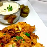 Chicken Shawarma · Boneless chicken marinated in lemon, yogurt, house spices and ground  served with pickles an...