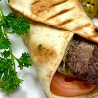 Steak Kabob Pita Wrap · Tender steak grilled to perfection, then warped in fresh Pita Bread with freshly sliced toma...