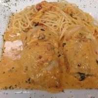 Rollatini · Two chicken breast stuffed with spinach and cheese in our signature pink vodka sauce over pa...