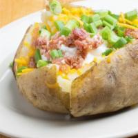 Baked Potato · Texas sized Baked Potato made w/ Real Bacon, Butter, Fresh-Cut Chives, Cheddar Cheese, and S...