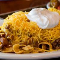 Regular Frito Pie · Fritos, chopped brisket, Bar-B-Q sauce, your choice of ranch or pinto beans, cheese, and sou...