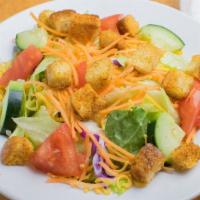 Dinner Salad · Your choice of dressing served on the side, iceberg lettuce, cucumbers, tomatoes, cheese, an...