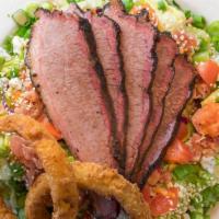 Bev'S Smokehouse Salad · Hickory smoked brisket over an iceberg/romaine blend with tomatoes, bacon, blue cheese crumb...