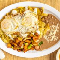 Chilaquiles · Huevo, frijoles, papas mexicanas, queso, salsa verde o roja. / Eggs, beans, Mexican potatoes...
