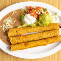 Flautas · Arroz y frijol. / Rice and beans.