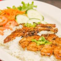 Grilled Pork Chop / Com Suon Nuong · Grilled pork chop. Slice cucumbers, tomatoes, pickled carrot, onion, and serve with steamed ...