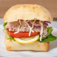 - Tuna Muna Sandwich · Our Classic Tuna Salad, topped with Romaine Lettuce, to Swiss Cheese and Red Onions on a Cia...