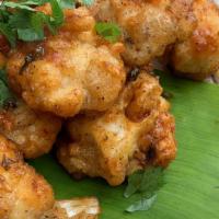 Vegan Wings · (lightly fried cauliflower tossed in your choice of savory sauce: Curry Lime, Teriyaki, Basi...