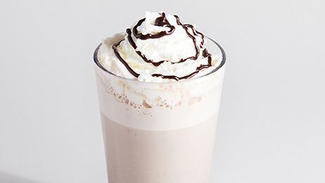 Hot Chocolate · A classic drink made with Ghirardelli Dark Chocolate. Topped with house-made whipped cream and chocolate drizzle. Perfect for any cool day.