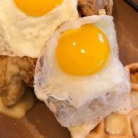 Chicken & Waffles · A crisp waffle topped with 2 chicken tenders & 2 eggs made to order.